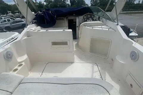 Slide: The Image of 2003 Rinker Fiesta Vee 270 boat interior with seating and steering wheel. - 6