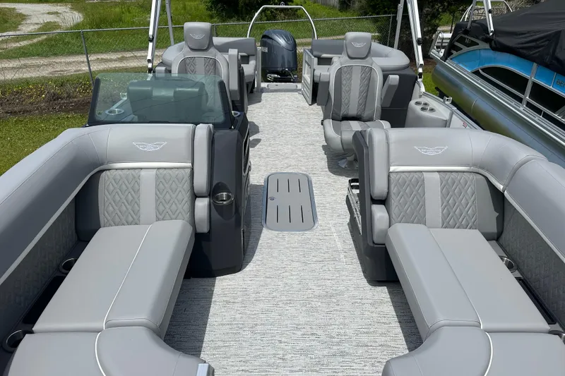 Slide: The Image of 2025 Bennington 22M pontoon boat interior with luxurious gray seating and modern design. - 5