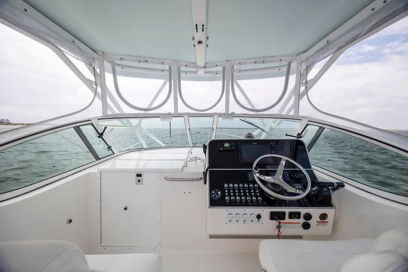 Slide: The Image of 2017 Stamas 370 Aegean boat helm with steering wheel and control panel on open water. - 18
