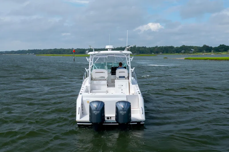 Slide: The Image of 2017 Stamas 370 Aegean boat cruising on a calm waterway under a cloudy sky. - 2