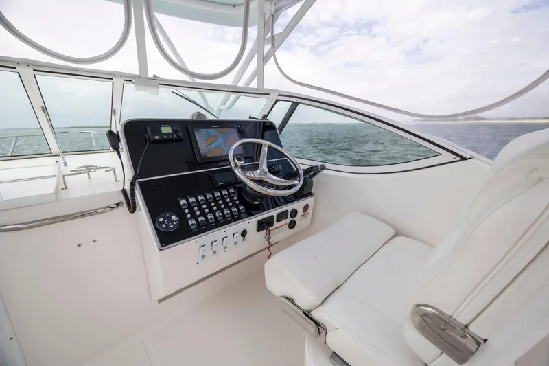 Slide: The Image of 2017 Stamas 370 Aegean boat helm with navigation controls and ocean view. - 21