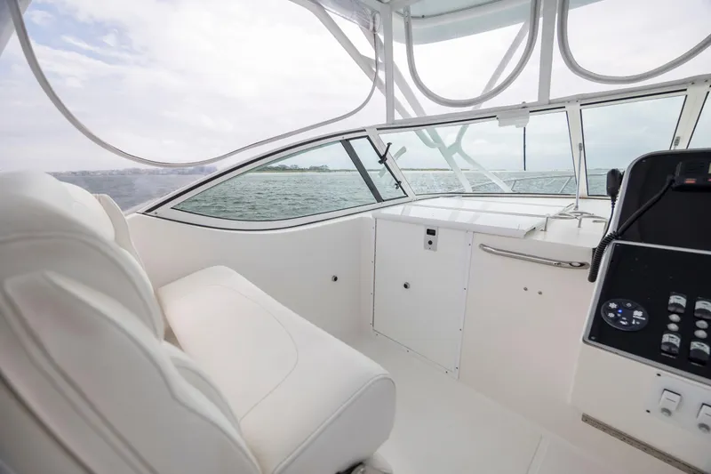 Slide: The Image of Interior view of 2017 Stamas 370 Aegean boat with white seating and control panel. - 24