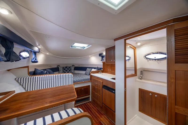 Slide: The Image of Luxurious interior of 2017 Stamas 370 Aegean yacht with wood finishes and cozy seating. - 25