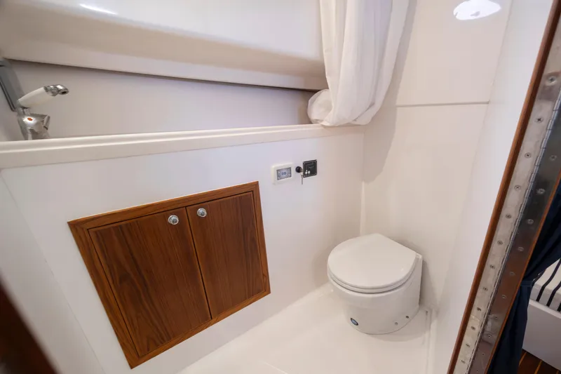 Slide: The Image of 2017 Stamas 370 Aegean boat bathroom with toilet, wooden cabinet, and shower. - 34