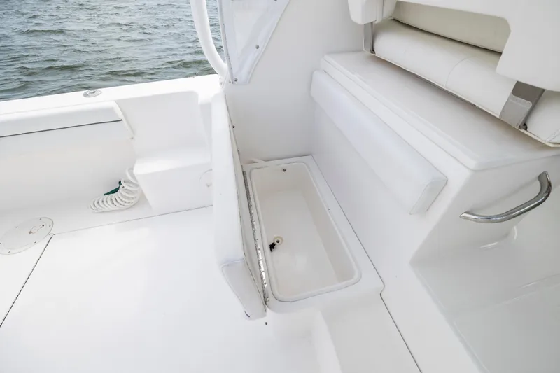 Slide: The Image of 2017 Stamas 370 Aegean boat interior with white seating and storage compartment. - 54