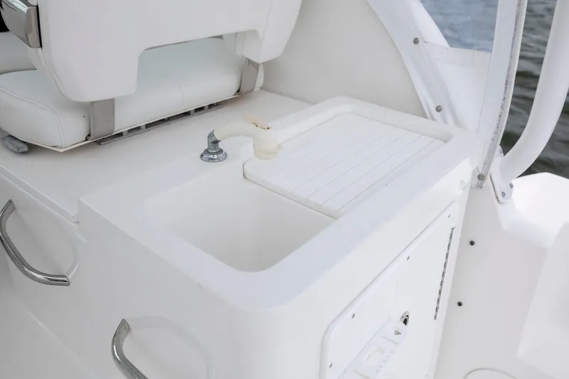 Slide: The Image of White sink and faucet on 2017 Stamas 370 Aegean boat, near cushioned seating. - 56