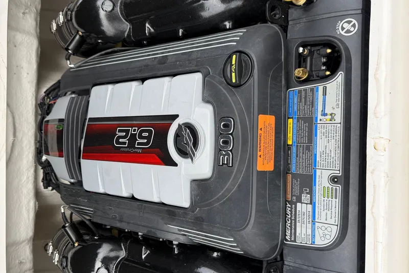 Slide: The Image of 2024 Chaparral 23 Surf boat engine, featuring a powerful 6.2L MerCruiser 300 horsepower motor. - 12