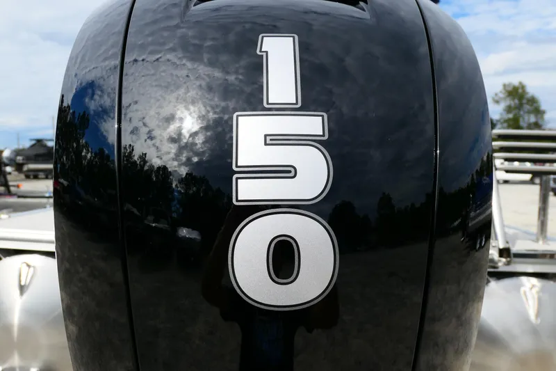 Slide: The Image of Close-up of a 150 horsepower outboard motor on a 2022 South Bay 224 RS boat. - 10