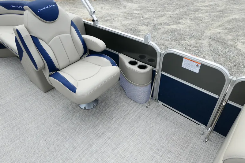Slide: The Image of 2022 South Bay 224 RS boat interior with plush seating and cup holders. - 2
