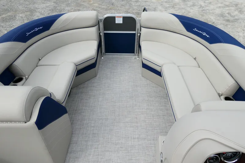 Slide: The Image of 2022 South Bay 224 RS pontoon boat interior with plush seating and modern design. - 7