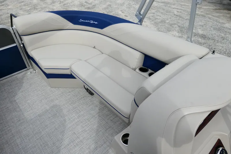 Slide: The Image of 2022 South Bay 224 RS boat interior with plush seating and cup holders. - 8