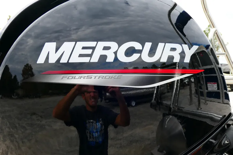 Slide: The Image of Mercury FourStroke engine on 2022 South Bay 224 RS boat, reflecting surroundings. - 9
