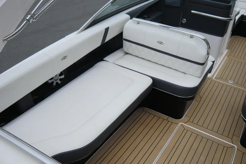 Slide: The Image of 2018 Regal 2800 Bowrider interior with white seating and teak-style flooring. - 12