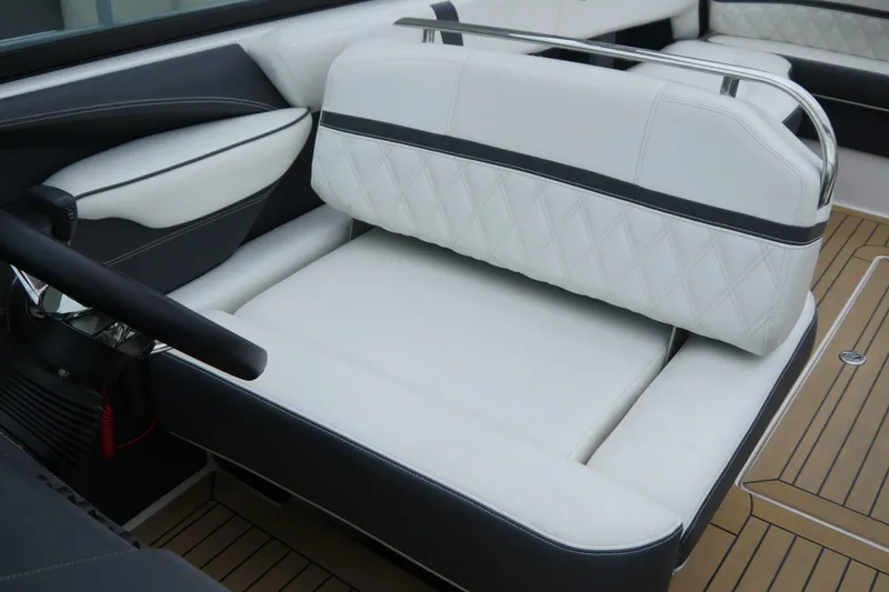 Slide: The Image of 2018 Regal 2800 Bowrider interior with white leather seating and sleek design. - 13