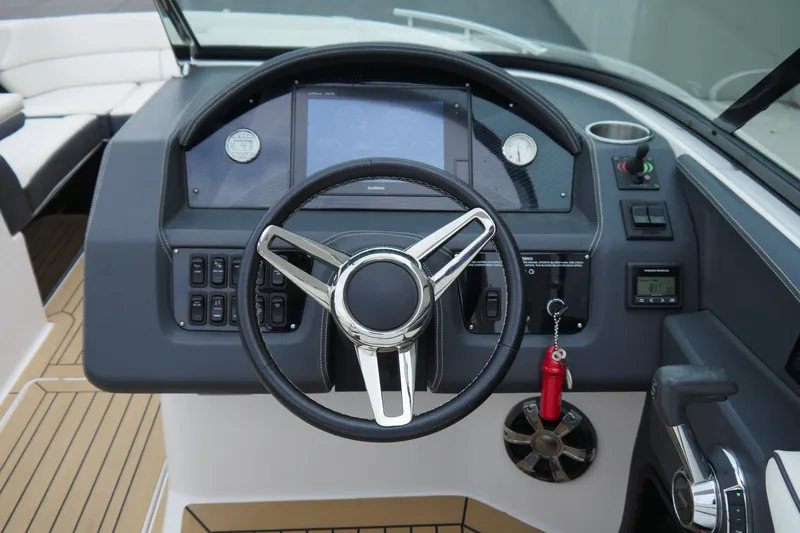 Slide: The Image of 2018 Regal 2800 Bowrider dashboard with steering wheel and control panel. - 14