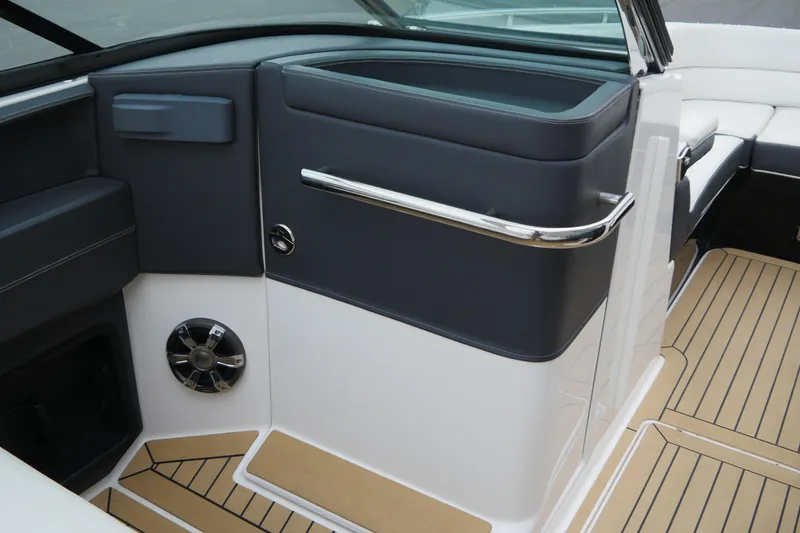 Slide: The Image of 2018 Regal 2800 Bowrider interior with sleek design, featuring cushioned seating and modern flooring. - 17