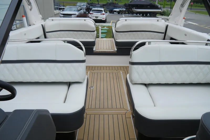 Slide: The Image of 2018 Regal 2800 Bowrider interior with white cushioned seating and teak flooring. - 20