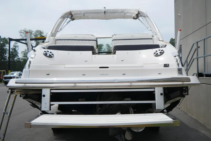 Slide: The Image of 2018 Regal 2800 Bowrider boat, rear view with swim platform and speakers. - 23