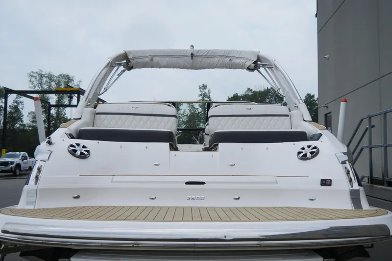 Slide: The Image of 2018 Regal 2800 Bowrider boat, rear view with seating and speakers. - 7