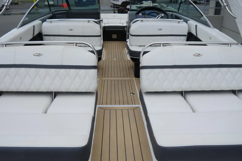 Slide: The Image of 2018 Regal 2800 Bowrider interior with luxurious white seating and teak flooring. - 9