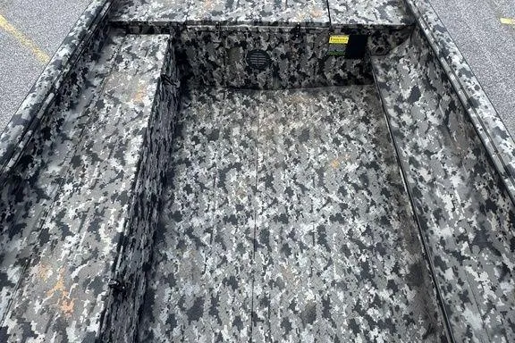 Slide: The Image of 2024 Havoc 1756 MRST boat interior with camouflage pattern design. - 12