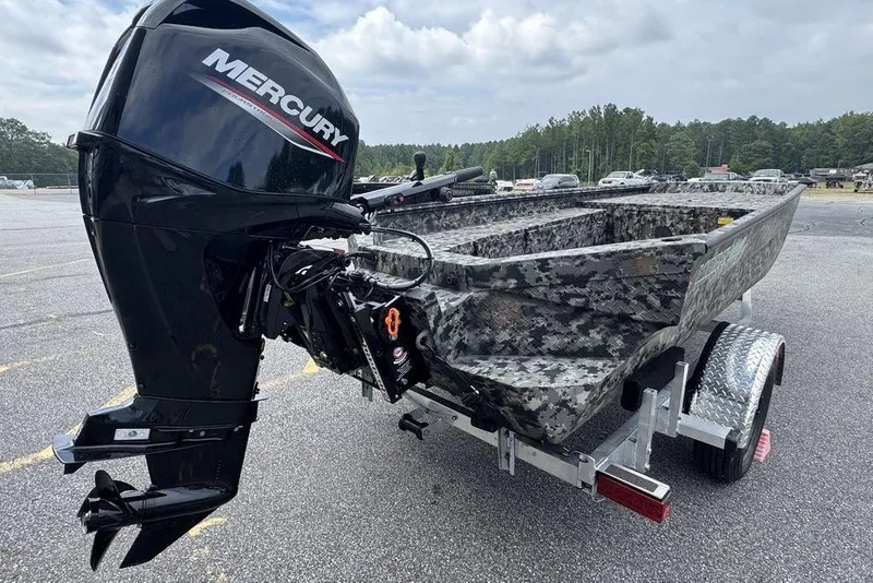 Slide: The Image of 2024 Havoc 1756 MRST boat with Mercury outboard motor on trailer. - 8