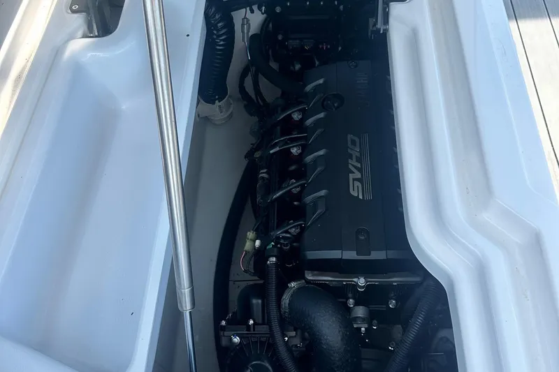 Slide: The Image of 2022 Yamaha Boats 275SD engine compartment with SVHO engine visible. - 10