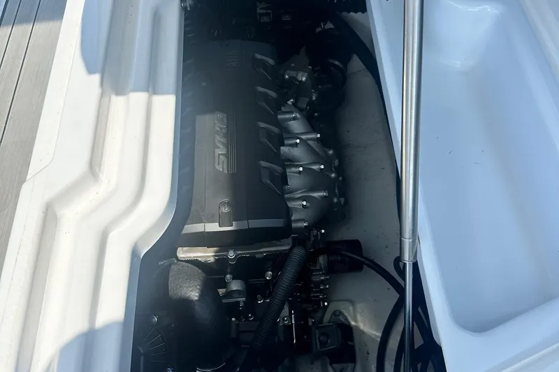 Slide: The Image of Engine compartment of 2022 Yamaha Boats 275SD, showcasing the powerful SVHO engine. - 11