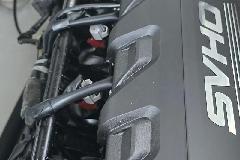 Slide: The Image of Close-up of 2022 Yamaha Boats 275 SD engine with SVHO branding. - 14