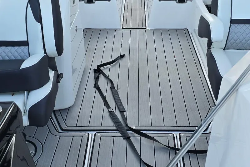 Slide: The Image of Interior of 2022 Yamaha Boats 275 SD, featuring sleek seating and modern flooring. - 19