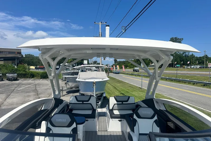 Slide: The Image of 2022 Yamaha Boats 275SD with sleek design and spacious seating on display. - 28