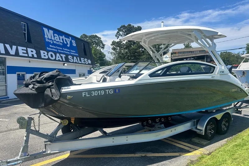 Slide: The Image of 2022 Yamaha Boats 275SD on trailer at river boat sales dealership. - 3