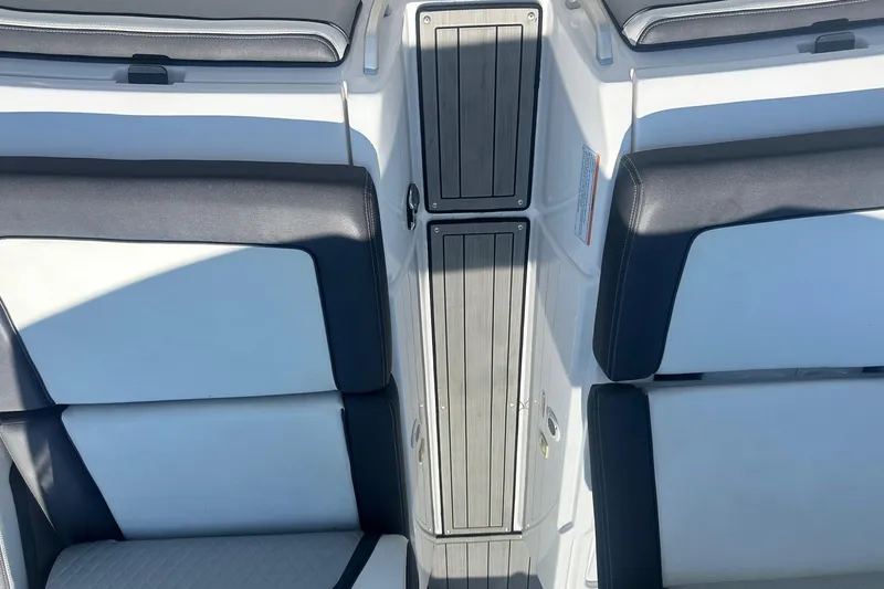 Slide: The Image of 2022 Yamaha Boats 275SD interior seating with sleek design and modern upholstery. - 32