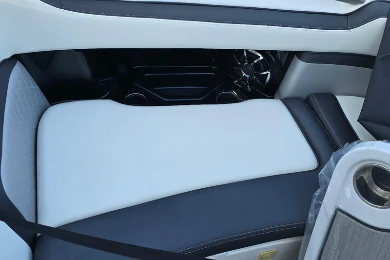 Slide: The Image of 2022 Yamaha Boats 275 SD interior seating with sleek black and white upholstery design. - 36