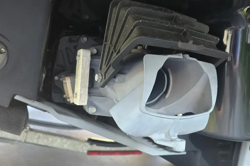 Slide: The Image of Close-up of 2022 Yamaha Boats 275 SD engine component, showcasing intricate mechanical details. - 7