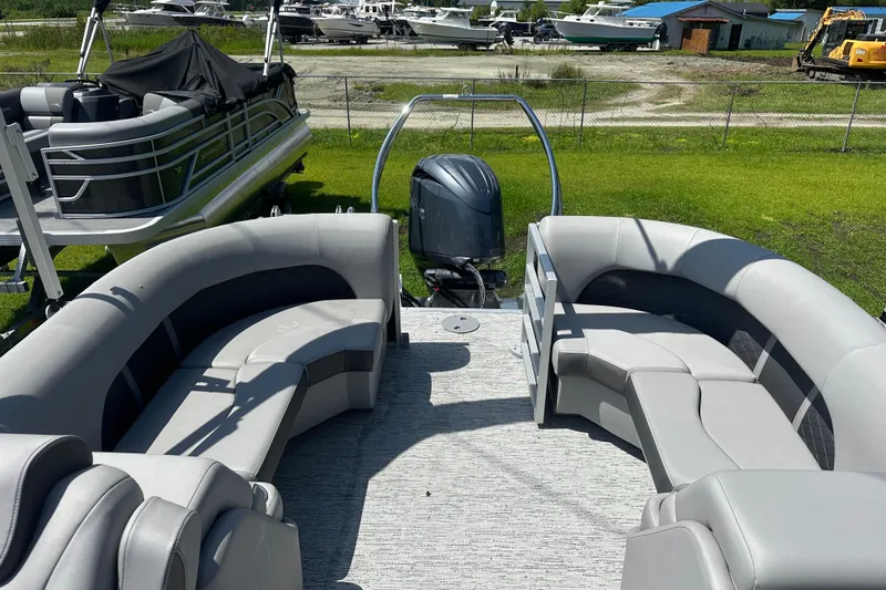 Slide: The Image of 2025 Bennington 22L pontoon boat with spacious seating and modern design. - 3