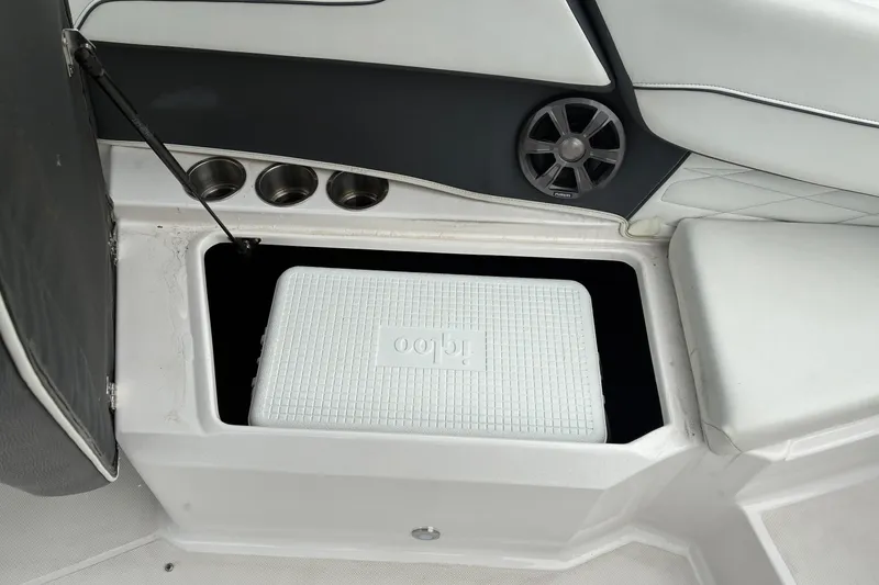Slide: The Image of 2020 Regal 23 OBX boat interior with storage compartment and Igloo cooler. - 17