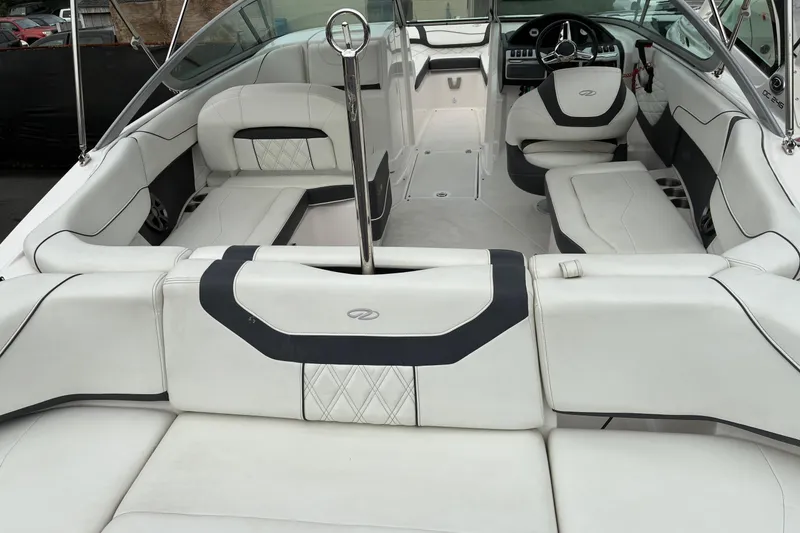 Slide: The Image of 2020 Regal 23 OBX boat interior with luxurious white seating and modern design. - 4