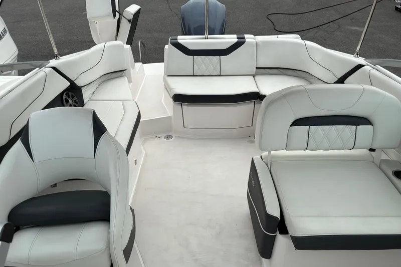 Slide: The Image of 2020 Regal 23 OBX boat interior with white and black seating arrangement. - 6