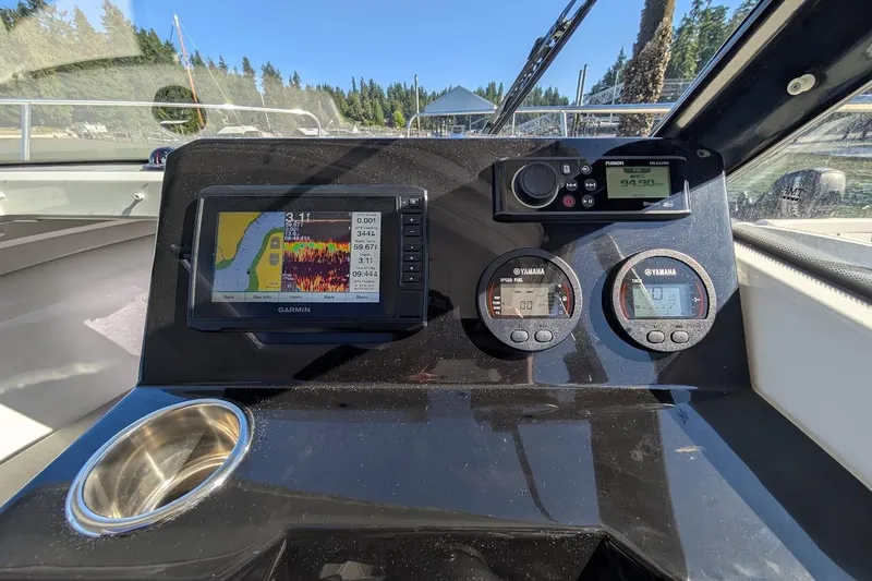 Slide: The Image of Dashboard of 2020 Jeanneau NC 695 Series 2 with Garmin navigation system. - 13