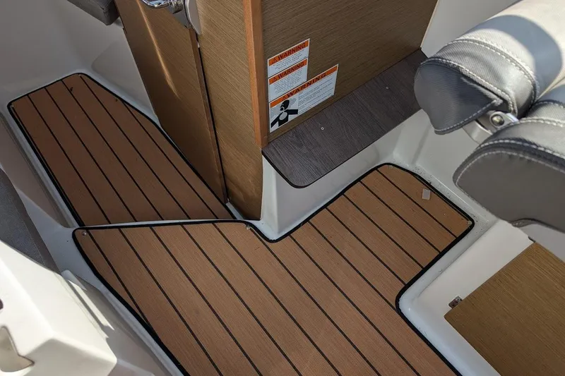 Slide: The Image of 2020 Jeanneau NC 695 Series 2 interior with wood flooring and seating. - 20