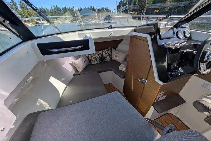 Slide: The Image of Interior of 2020 Jeanneau NC 695 Series 2 boat with cozy seating and modern dashboard. - 8