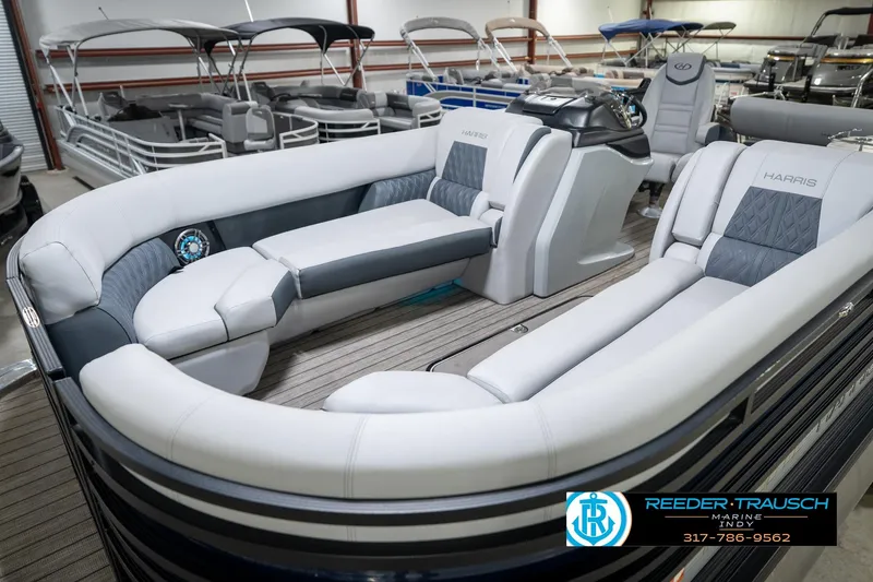 Slide: The Image of 2020 Harris Solstice pontoon boat interior with luxurious seating in showroom. - 12