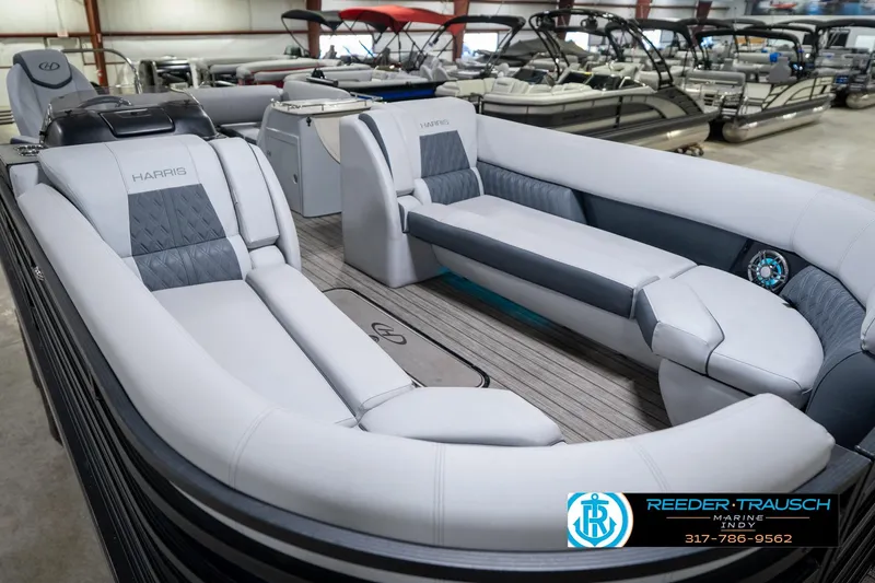 Slide: The Image of 2020 Harris Solstice boat interior with luxurious seating at Reeder-Trausch Marine showroom. - 13