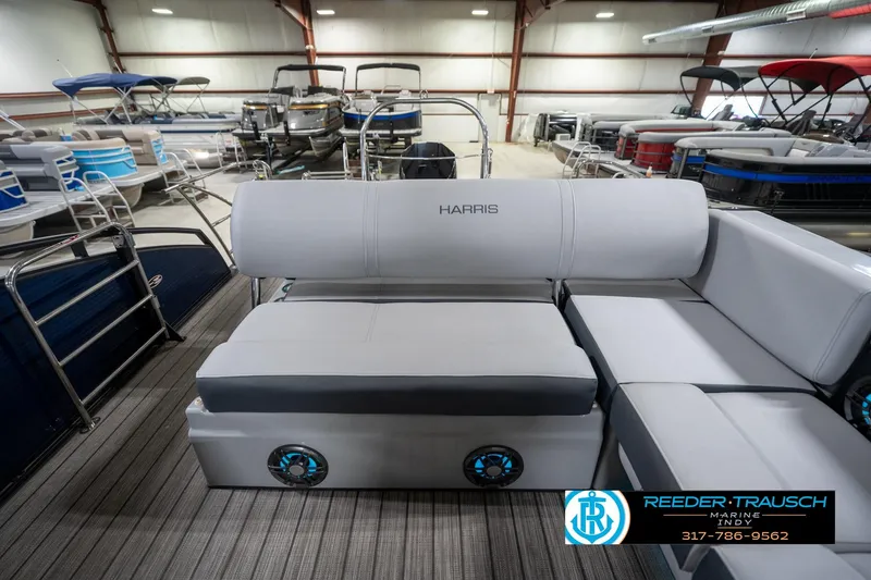 Slide: The Image of 2020 Harris Solstice boat interior with seating and steering wheel in showroom. - 16
