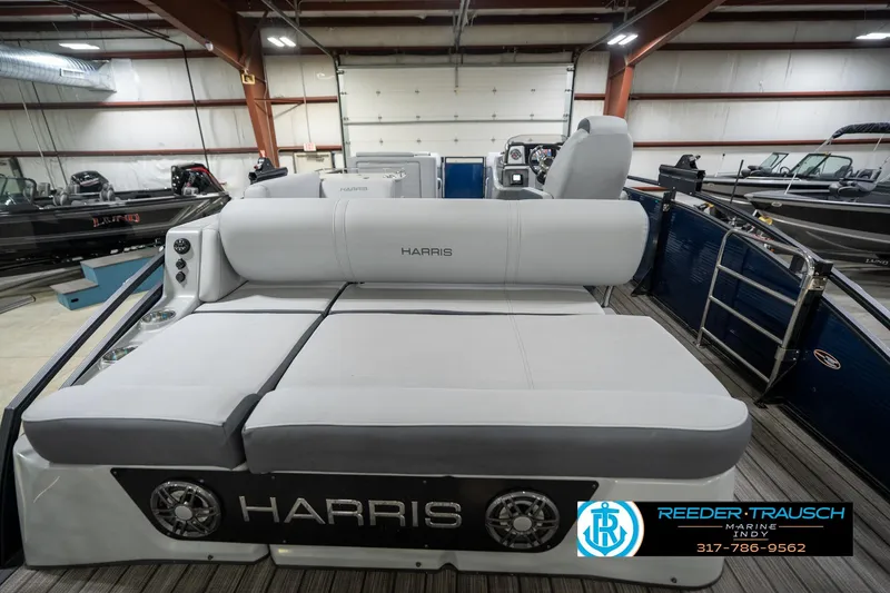 Slide: The Image of 2020 Harris Solstice pontoon boat interior with gray seating in a showroom. - 17
