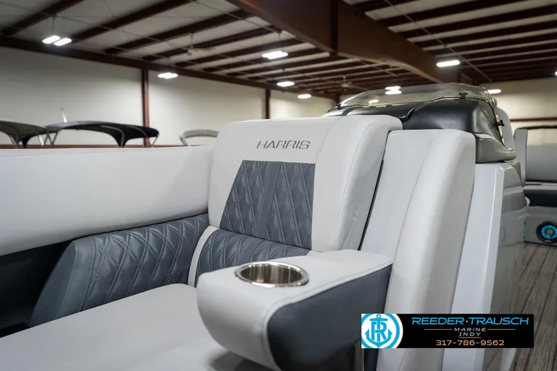 Slide: The Image of 2020 Harris Solstice boat interior with gray and white seating, showcased at Reeder-Trausch Marine. - 22
