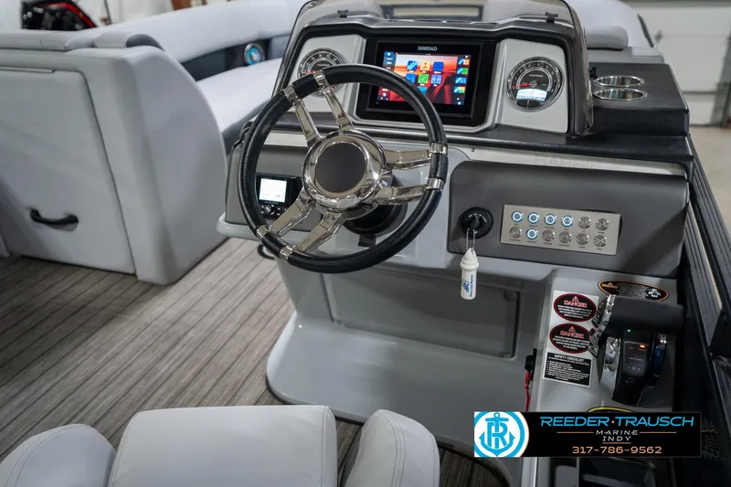 Slide: The Image of 2020 Harris Solstice boat interior with sink and cup holders at Reeder-Trausch Marine. - 29