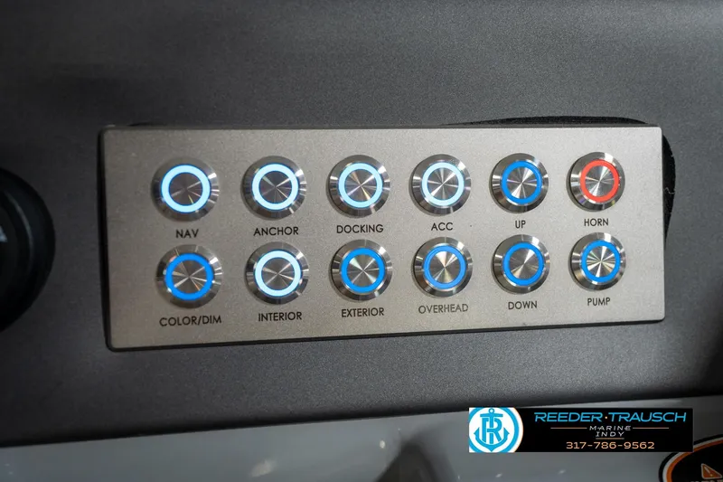 Slide: The Image of Close-up of a 2020 Harris Solstice ignition switch and control panel with illuminated buttons. - 37