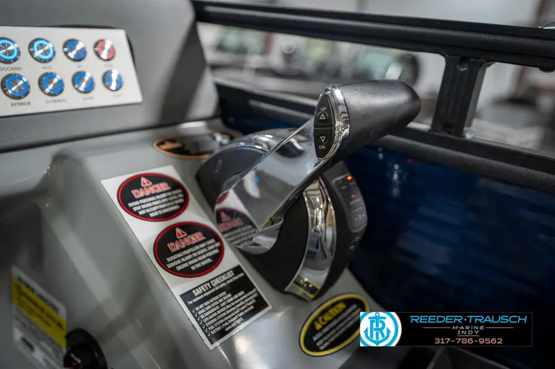 Slide: The Image of Active trim control panel on a 2020 Harris Solstice boat dashboard. - 39